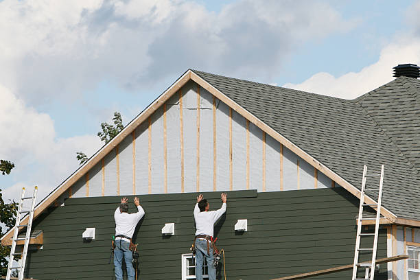 Professional Storm Damage Siding Repair technician working in Matthews, NC